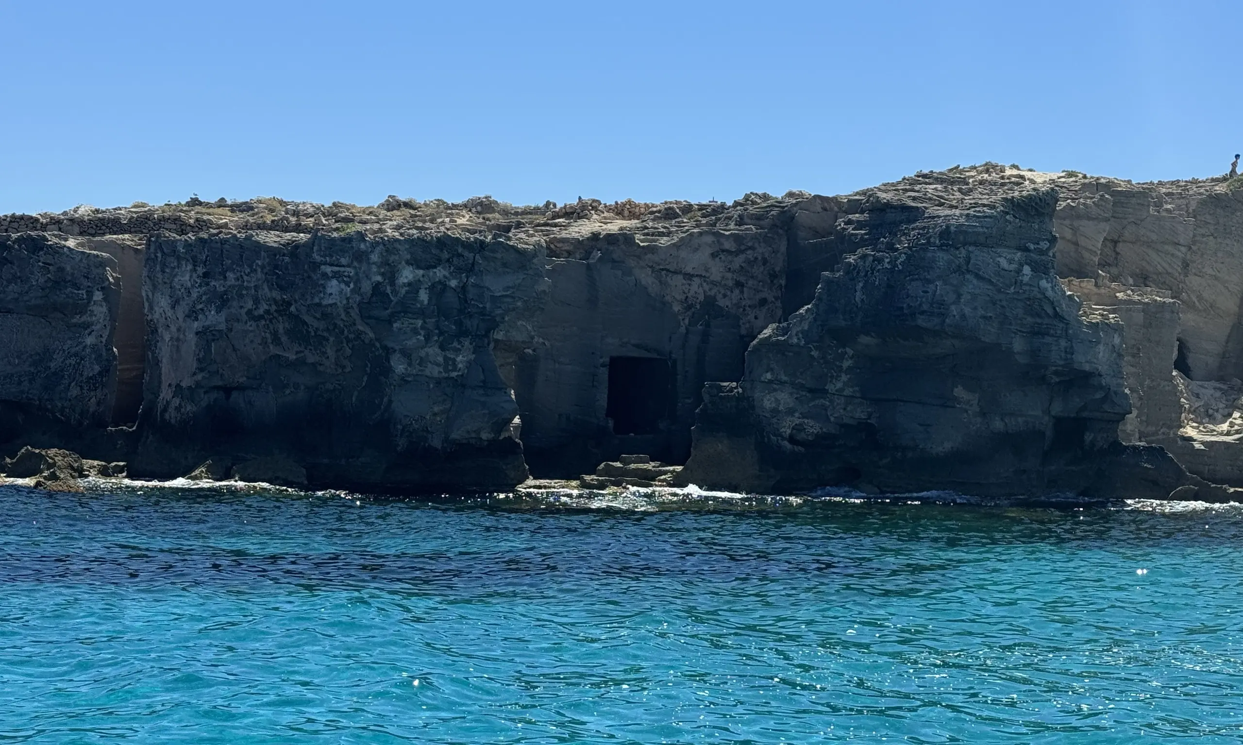 Favignana's tuff quarries seen from the sea