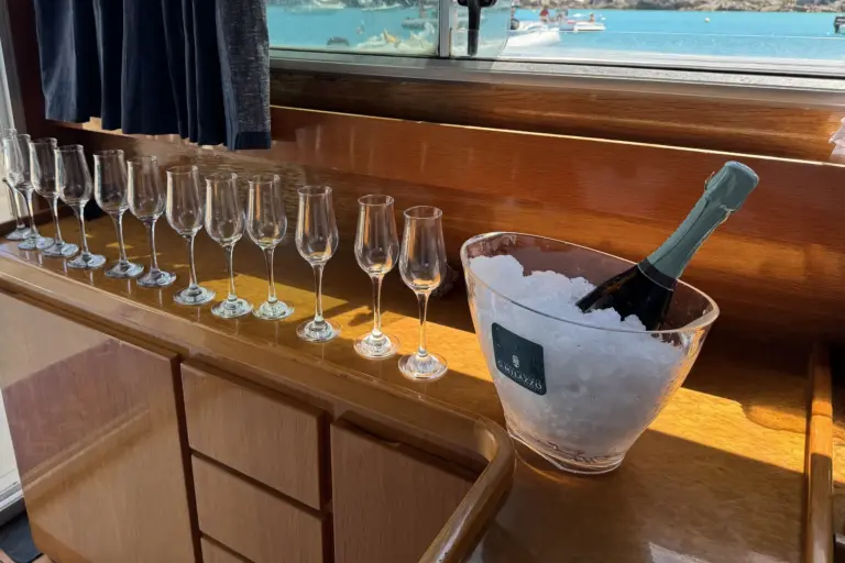 Bubbly on ice and a row of glasses in the boat's saloon